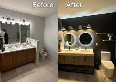 Before and after comparison of a bathroom renovation showcasing the replacement of a traditional double vanity and lighting with a modern floating vanity, LED-lit mirrors, stylish wall sconces, and a dark accent wall with decorative wooden shelves.