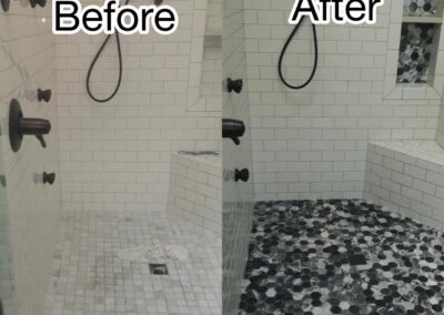 This shower renovation features an updated hexagonal tile floor in black, gray, and white for a modern touch.