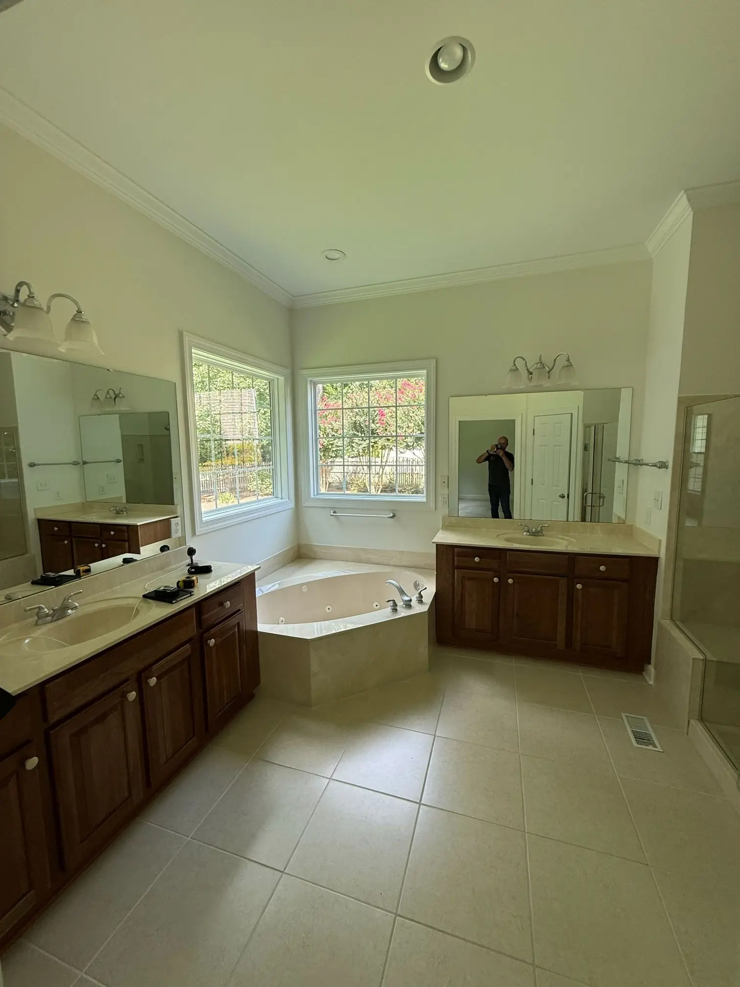 Outdated master bathroom before renovation with old vanity and bathtub
