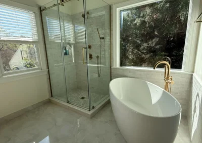 Modern luxury bathroom remodel with freestanding tub and glass shower