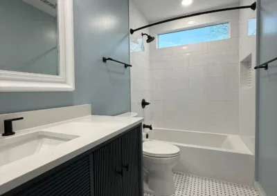 Bright bathroom remodel with vanity sink and bathtub combination