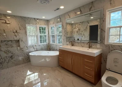 Large luxury bathroom remodel with bathtub and double vanity