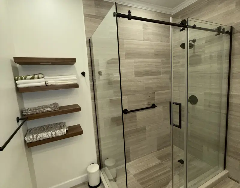 Frameless Glass Shower with Floating Wood Shelves
