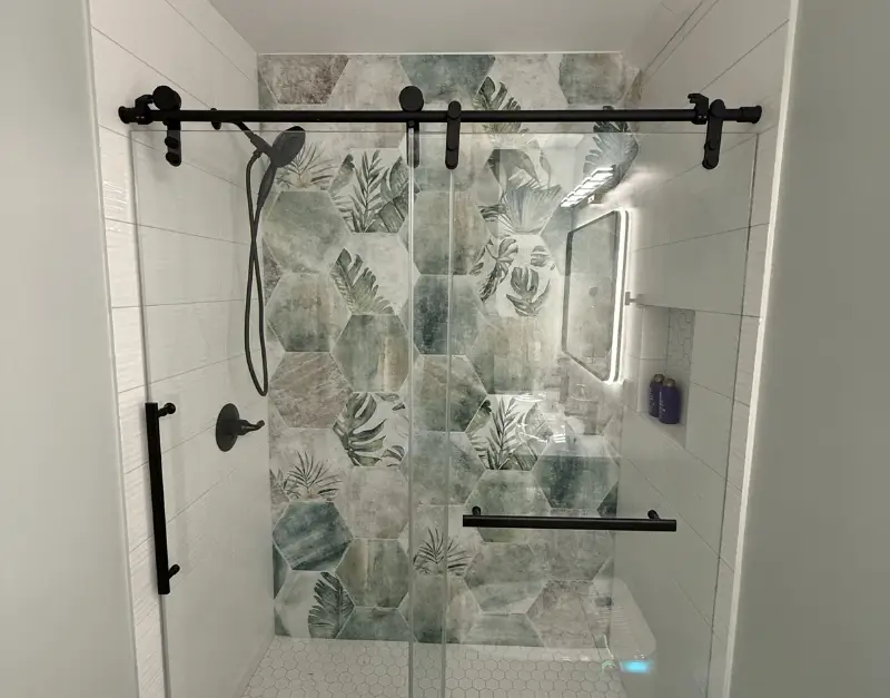 Frameless Glass Shower with Decorative Botanical Tile